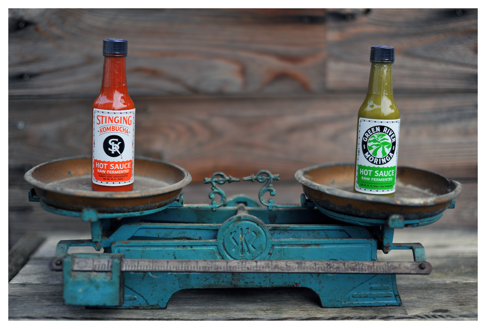 Stinging Kombucha Hot Sauce bottle outdoors